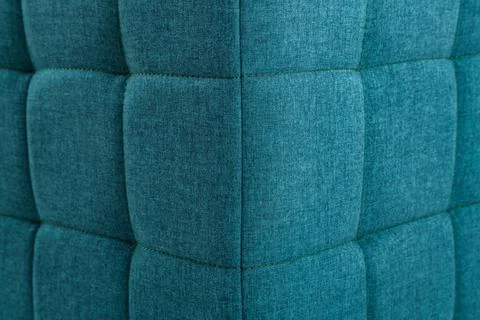 Texture blue fabric. Background of a soft pouf. Stock Photos