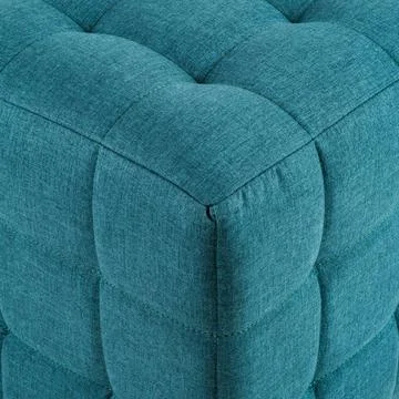 Texture blue fabric. Background of a soft pouf. Stock Photos
