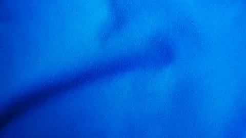 The texture of blue fabric. Stock Photos