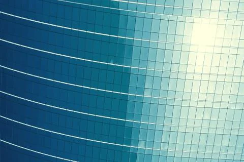 Texture of blue glasses pattern wall in modern hight building with cloud refl Foto stock