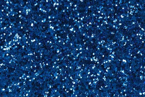 Texture from blue glitter. Stock Photos