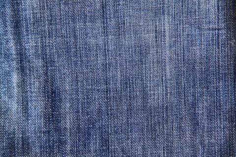 Texture of blue jeans as a background Stock Photos