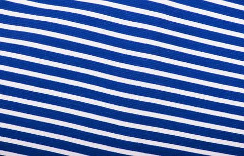Texture of blue jeans background, ripped jeans Stock Photos