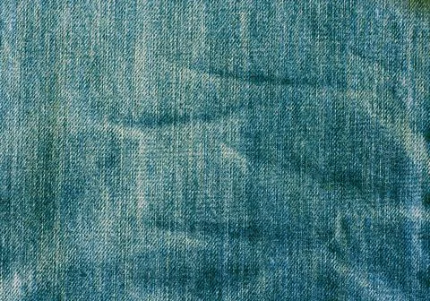 Texture of blue jeans Stock Photos