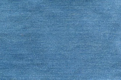 Texture of blue jeans textile Stock Photos
