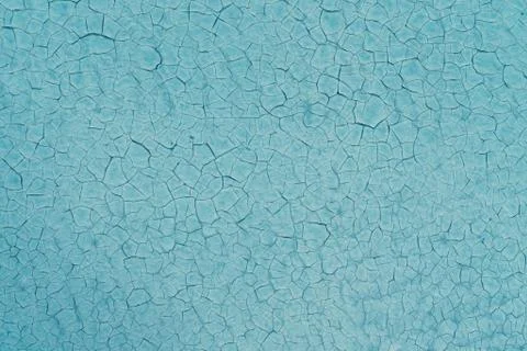 Texture of blue painted wall with cracks in the paint Stock Photos