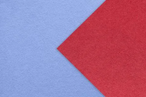Texture of blue paper background, half two colors with red arrow, macro. Foto stock