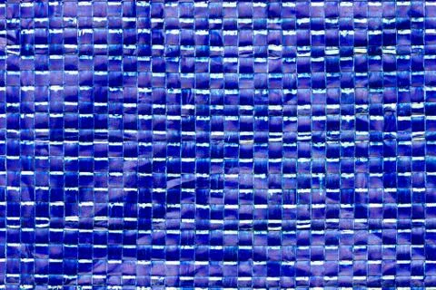 Texture of blue plastic net bag. Stock Photos
