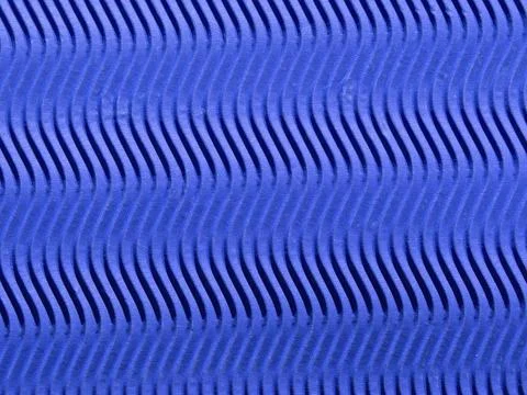 The Texture Of Blue Pressed Paper In Vertical Waves. Blue Corrugated Wavy C.. Stock Photos