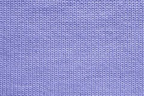 Texture of blue violet wool knitted sweater close-up. Stock Photos