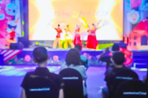 Texture blur scene multicolored lights in performance on stage. Stock Photos