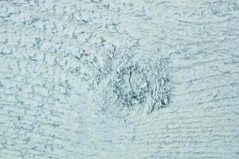 Texture of the board with a knot painted light-turquoise color Stock Photos