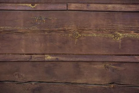 The texture of the boards is dark brown. Stock Photos