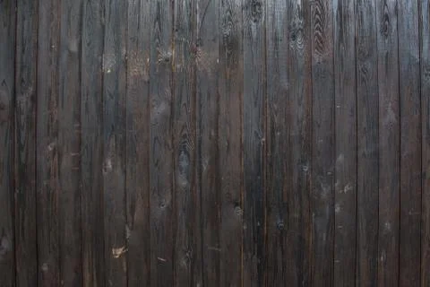 The texture of the boards is dark brown. Stock Photos