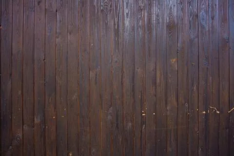 The texture of the boards is dark brown. Stock Photos