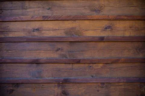 The texture of the boards is dark brown. Stock-Fotos