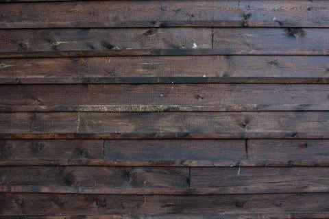 The texture of the boards is dark brown. Stock Photos
