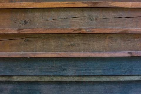 The texture of the boards is dark brown. Stock-Fotos