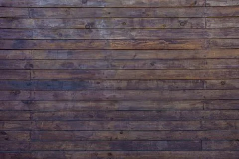 The texture of the boards is dark brown. Stock Photos