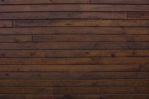 The texture of the boards is dark brown. Stock Photos