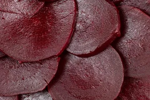 Texture of boiled red beetroot cut into slices top view Stock Photos