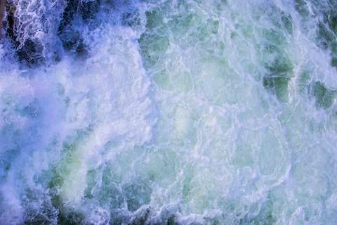Texture of boiling water, waterfall, mountain river, boiling streams with foa Stock Photos