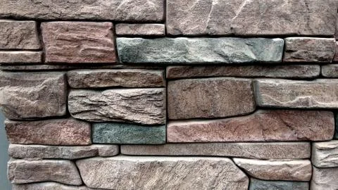 Texture Brick modern wall for background. Bricks of different sizes in warm Stock Photos