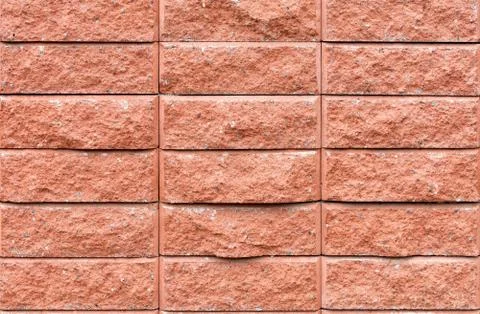 The texture of the brick tiles on the facade of the wall closeup. Stock Photos