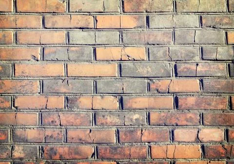 Texture of a  brick wall background in the countryside . rough blocks of ston Stock Photos