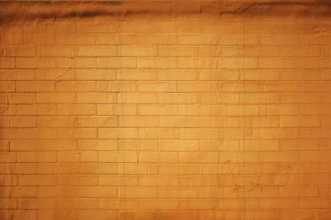 Texture of a brick wall coated in rich burnt-orange paint, showing fine mor.. Stock Photos