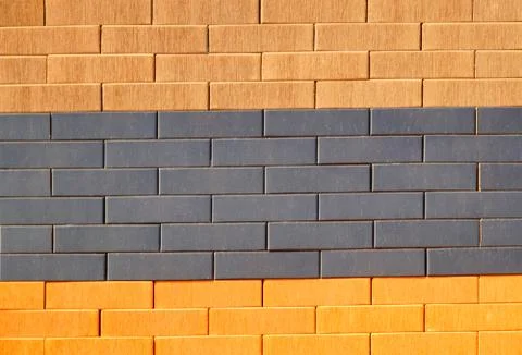 The texture of the brick wall of different colors for construction. Facing Stock Photos