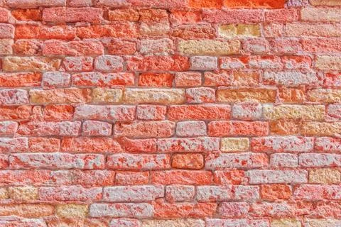 Texture of a brick wall made from an old red brick. Picture taken in Venice. Stock Photos