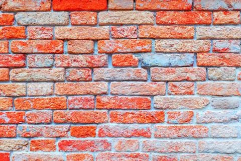 Texture of a brick wall made from an old red brick. Picture taken in Venice. Stock Photos