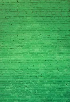 The texture of the brick wall of many rows of bricks painted in green color Stock Photos