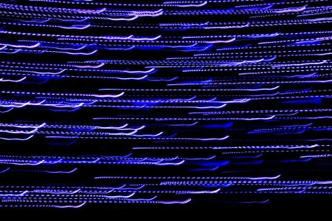 Texture, bright abstract lines, stripes and spots on a black background Stock Photos