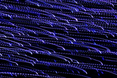 Texture, bright abstract lines, stripes and spots on a black background Stock Photos