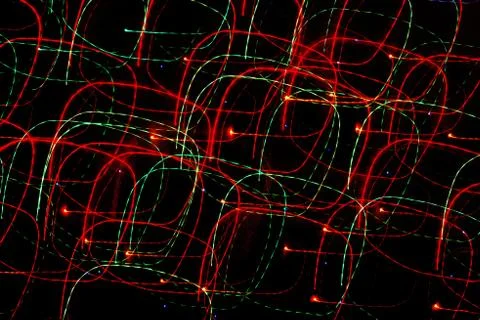 Texture, bright abstract lines, stripes and spots on a black background Stock Photos