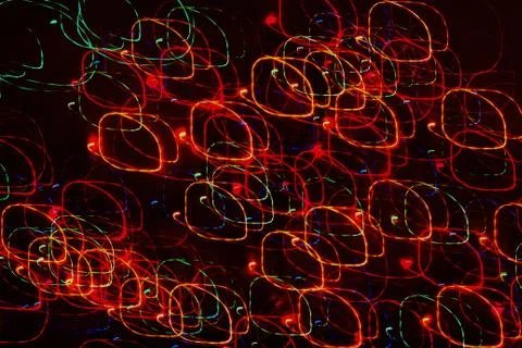 Texture, bright abstract lines, stripes and spots on a black background Stock Photos