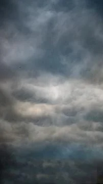 Texture of bright blue dramatic cloudy sky. Stock Photos