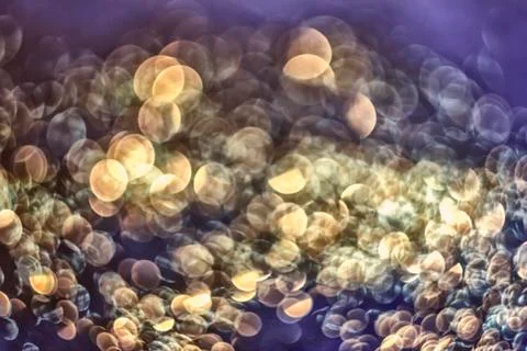 Texture of bright blurry background of sparkles, sequins, sparkling dust, blu Stock Photos