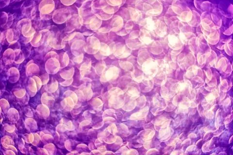 Texture of bright blurry background of sparkles, sequins, sparkling dust, blu Stock Photos