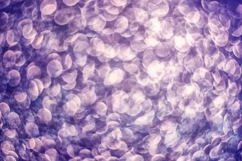 Texture of bright blurry background of sparkles, sequins, sparkling dust, blu Stock Photos