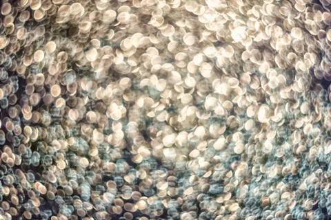 Texture of bright blurry background of sparkles, sequins, sparkling dust, blu Stock Photos