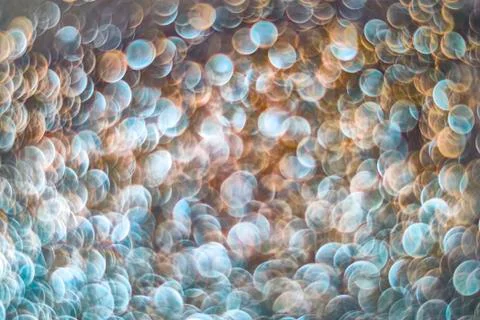 Texture of bright blurry background of sparkles, sequins, sparkling dust, blu Stock Photos