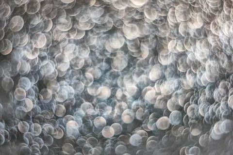 Texture of bright blurry background of sparkles, sequins, sparkling dust, blu Stock Photos