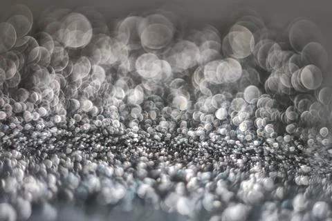 Texture of bright blurry background of sparkles, sequins, sparkling dust, blu Stock Photos