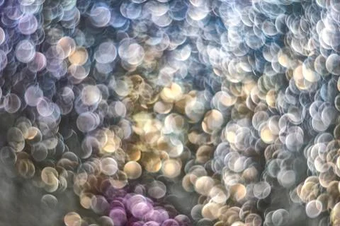 Texture of bright blurry background of sparkles, sequins, sparkling dust, blu Stock Photos