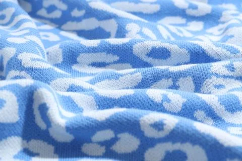 Texture of bright knitted fabric with pattern as background, closeup Foto stock
