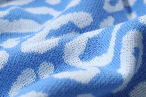 Texture of bright knitted fabric with pattern as background, closeup Foto stock