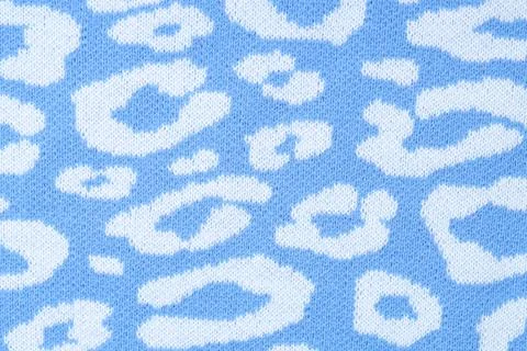 Texture of bright knitted fabric with pattern as background, top view Foto stock